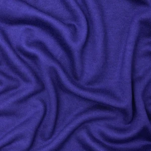 Tela de Punto Soft Lima Knit de meetMILK en un vibrante color azul lapis, dispuesta en pliegues suaves para mostrar su textura elegante y caída pesada.