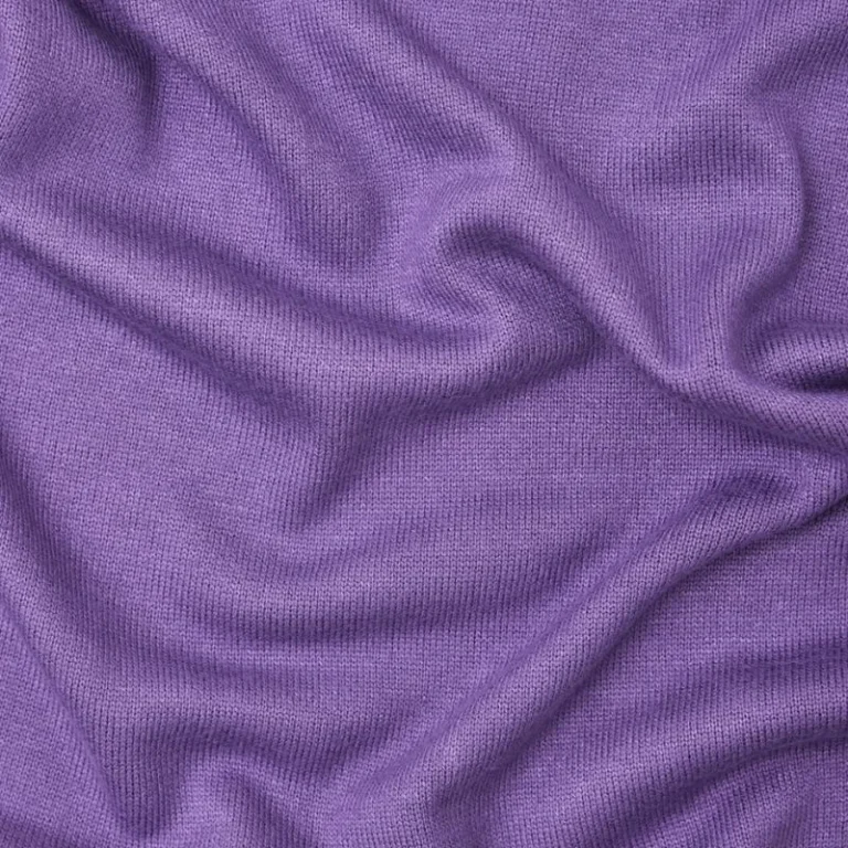 Tela de Punto Soft Lima Knit de meetMILK en un delicado color malva, dispuesta en pliegues suaves para mostrar su textura elegante y caída pesada.